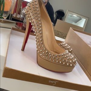 Tan spikes Christian louboutin heel.
